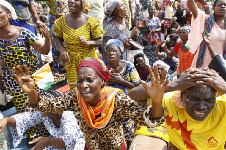 Members of the Women's Christian Association pray for peace in Abidjan, Ivory Coast, on Dec. 27.  Fears of a regional military intervention grew following a threat from West African neighbors to force out incumbent leader Laurent Gbagbo if he does not soon heed international calls to step down from power.